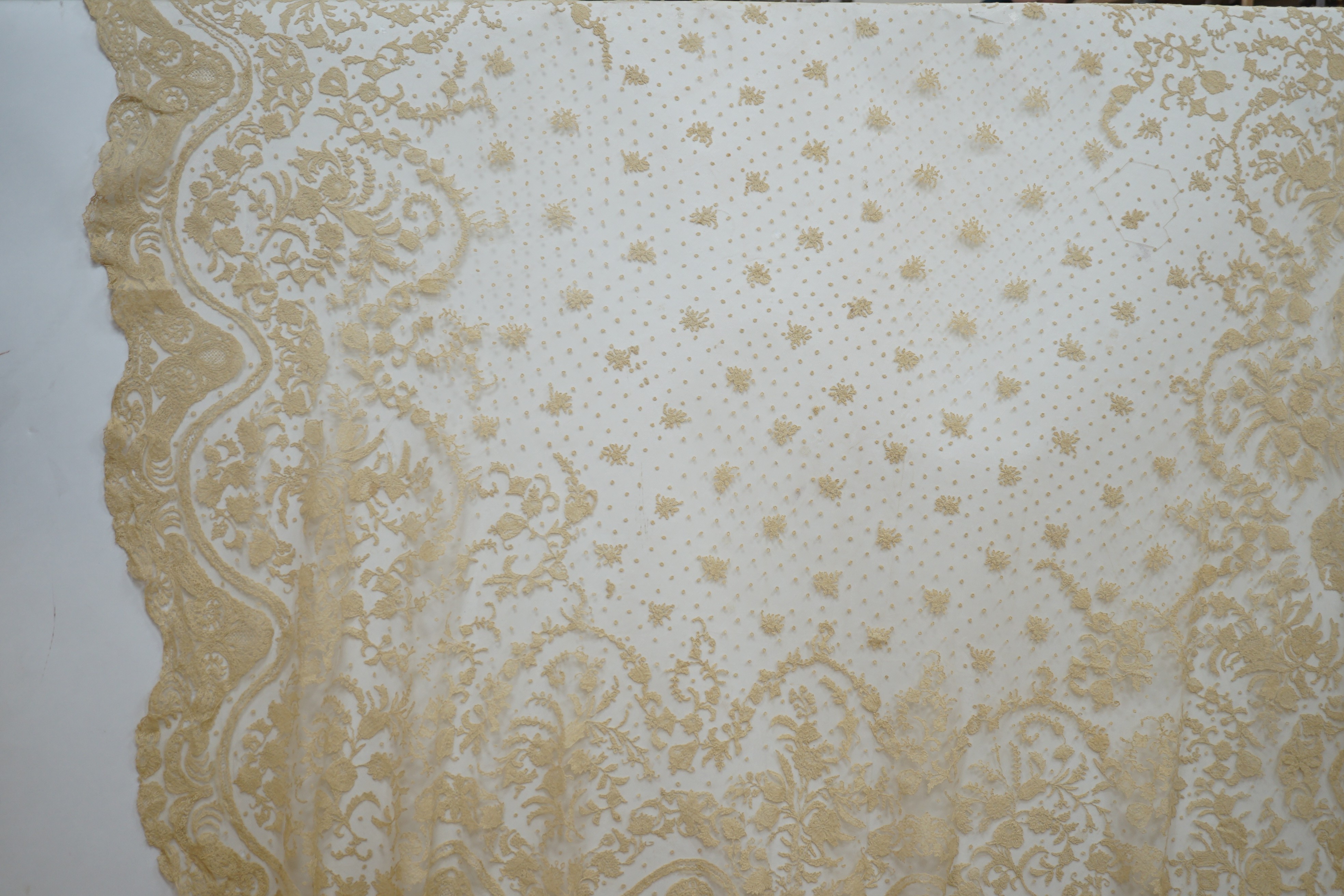 A rare length (9 and a half yards) of Brussels 19th century needle lace, some repairs and damage, circa 1880 and a similar wedding veil